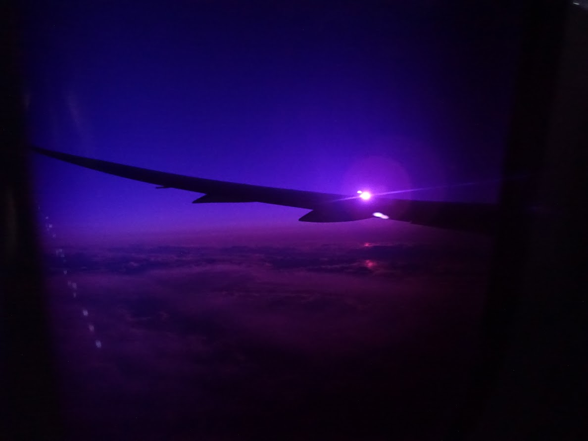 Sunrise with a purple glow in the airplane